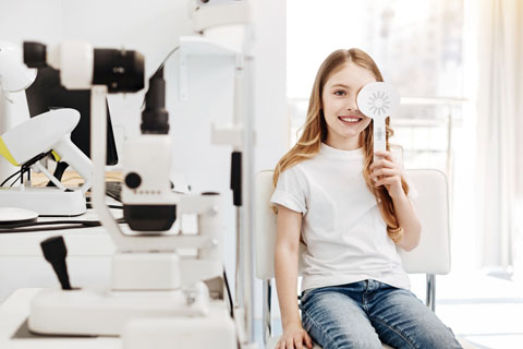 Young girl having eyes evaluated